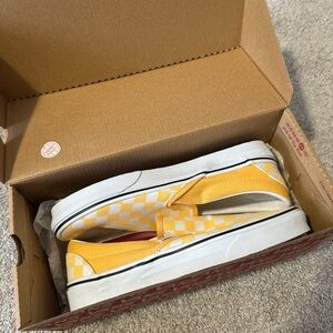 Yellow and white checkered slip on vans